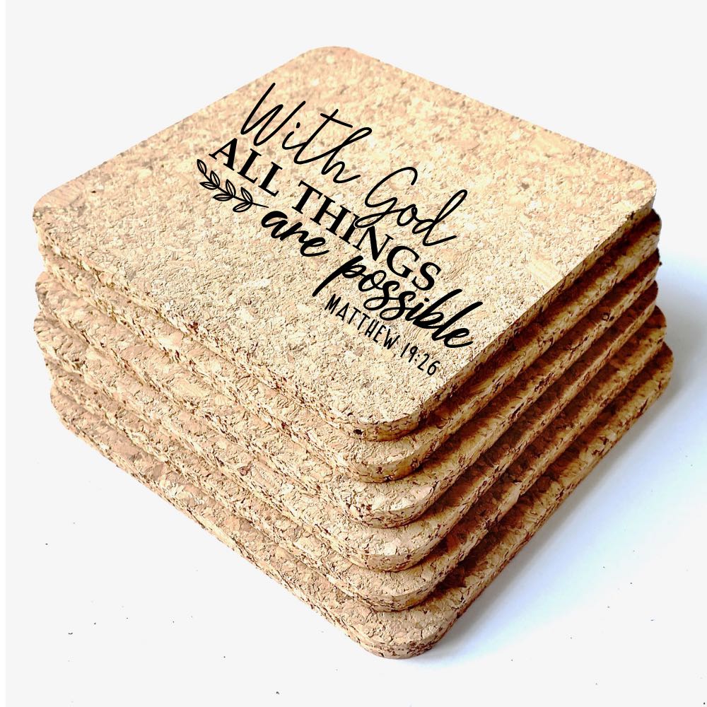 Close up view of the stack of 6 square cork coasters The top coaster is engraved with the Bible verse, "With God all things are possible".