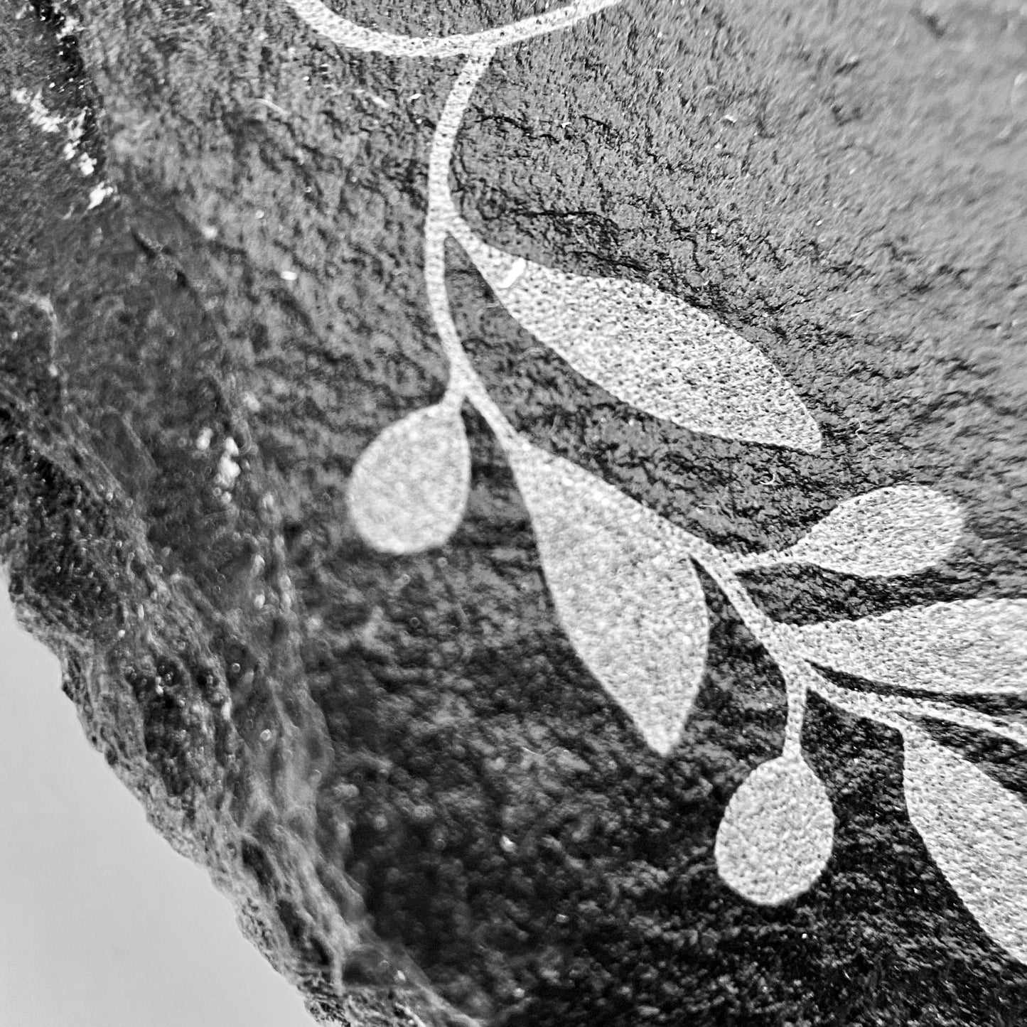 Close up photo of the precision and quality of engraving that you can expect on your slate coasters.