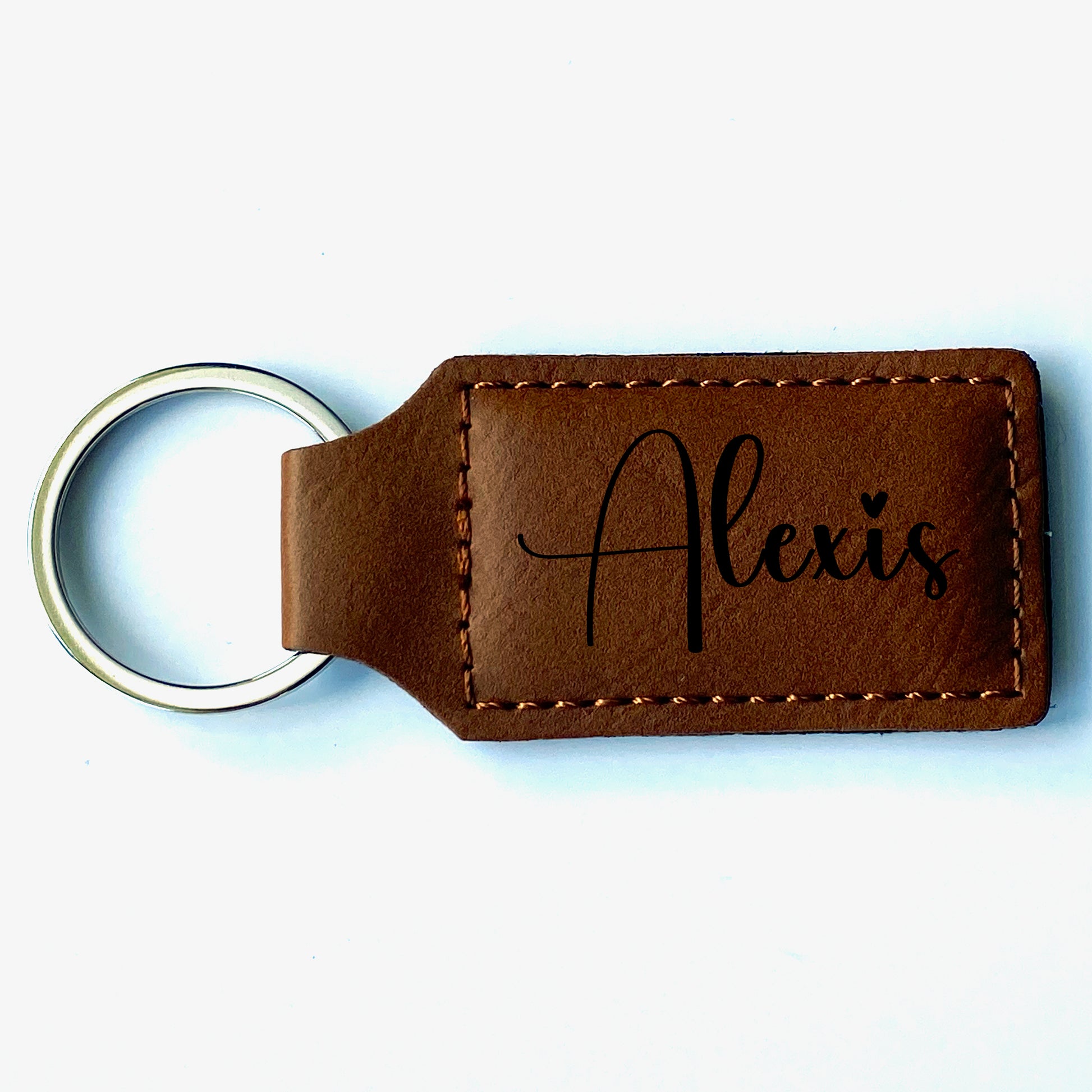 Chestnut faux leather keychain with customized name. 