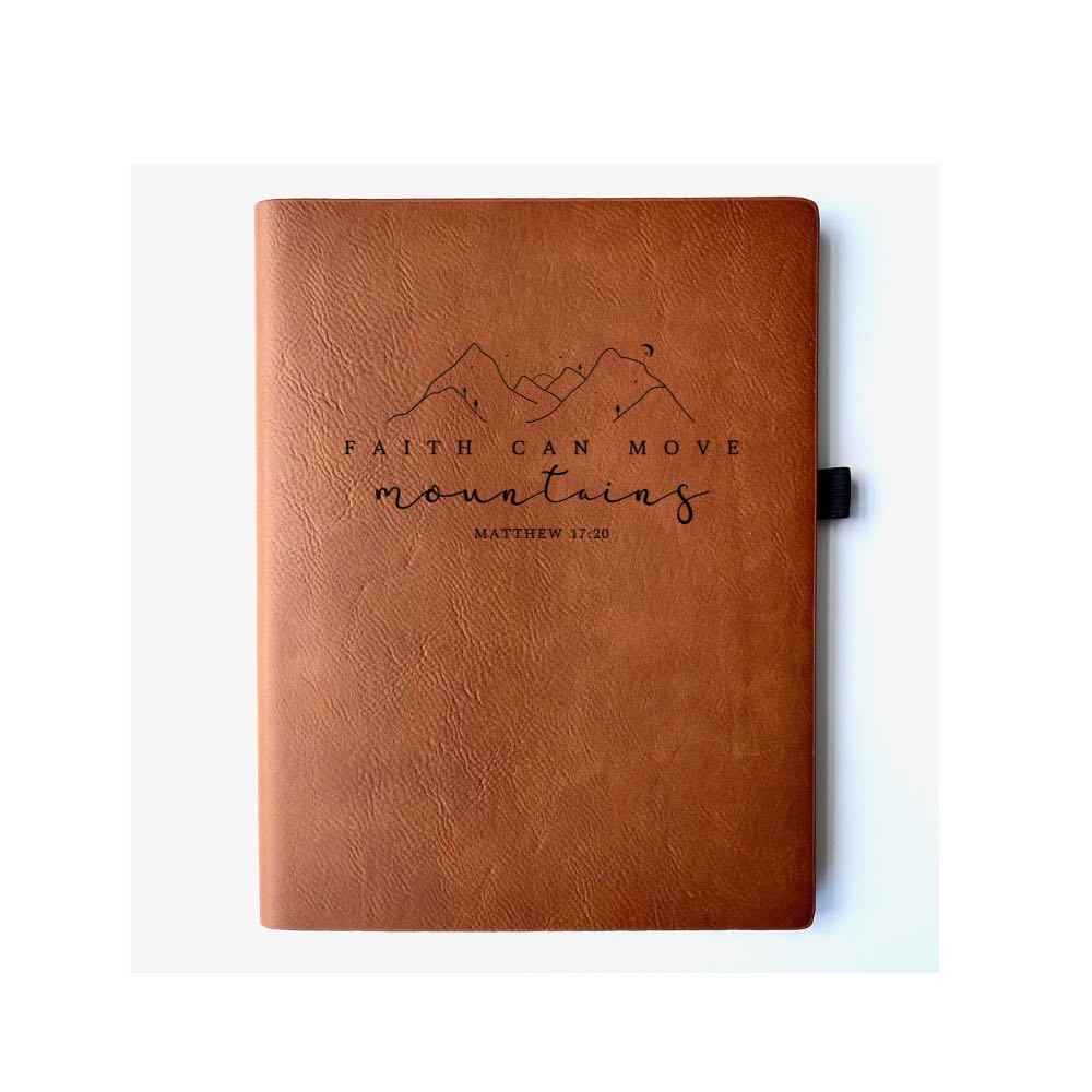 Chestnut Faux leather journal with "Faith Can Move Mountains Matthew 17:20" engraved on it. Can be personalized with your name or business logo in the bottom right corner. A matching pen can be engraved to complete the set.