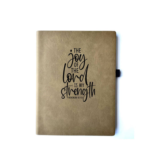 Buckskin Faux leather journal with "Faith Can Move Mountains Matthew 17:20" engraved on it. Can be personalized with your name or business logo in the bottom right corner. A matching pen can be engraved to complete the set.