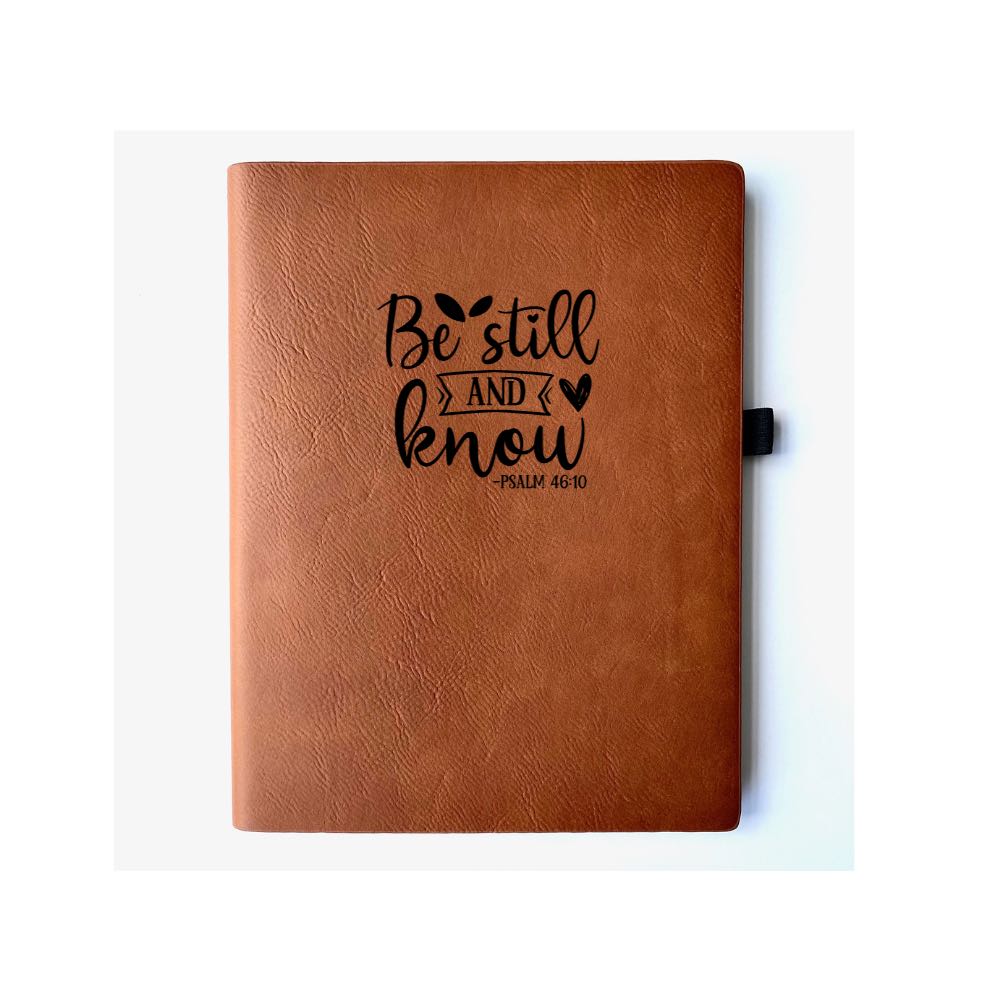 Chestnut Faux leather journal with "BE STILL AND KNOW PSALM 46:10" engraved on it. Can be personalized with your name or business logo in the bottom right corner. A matching pen can be engraved to complete the set.