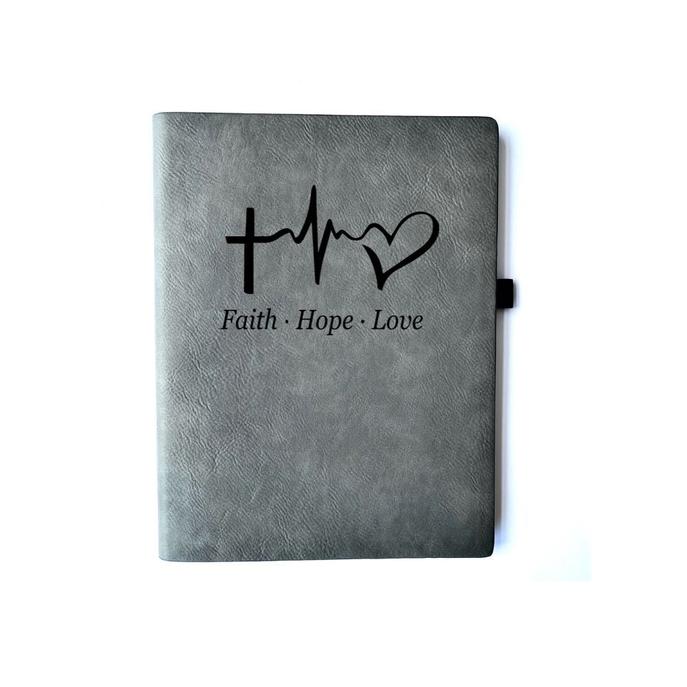 Iron Gray Faux leather journal with Faith, Hope, Love engraved. Can be personalized with your name or business logo in the bottom right corner. This color does not come with a matching pen.