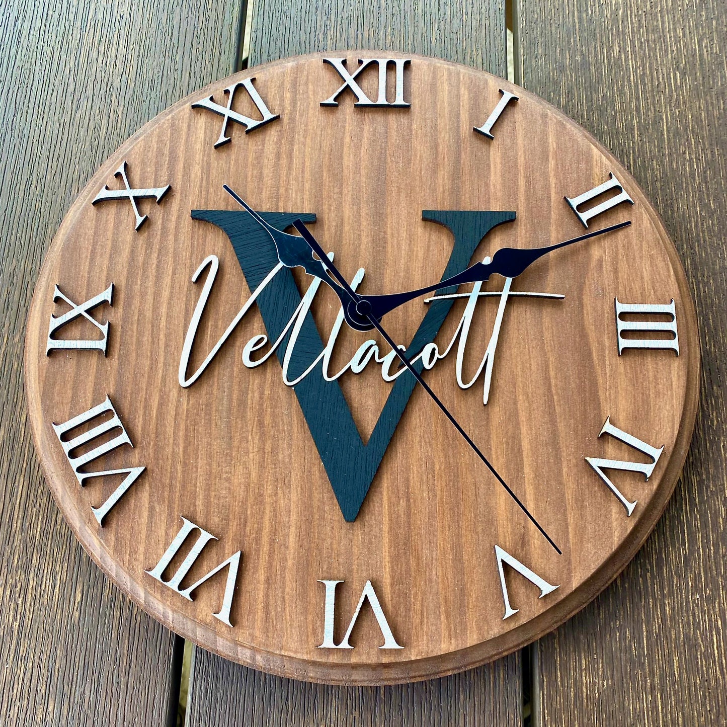 Vintage Rustic Oak Wooden 12 inch round custom Monogram name clock with surname and initial and wedding or special date. Close up details of roman numerals and elegant spade clock hands.