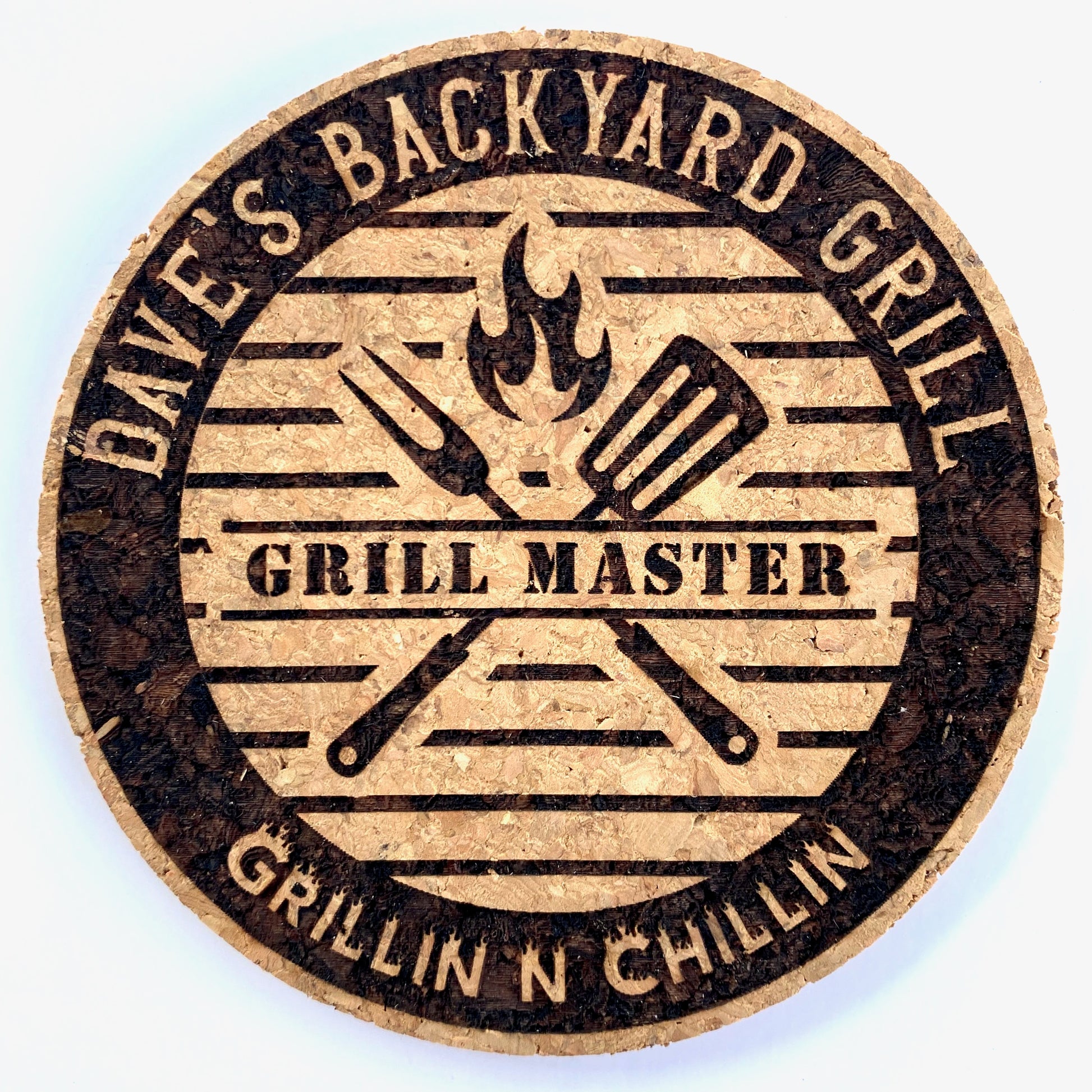 Round cork coaster custom engraved with first name on our Grill Master design.