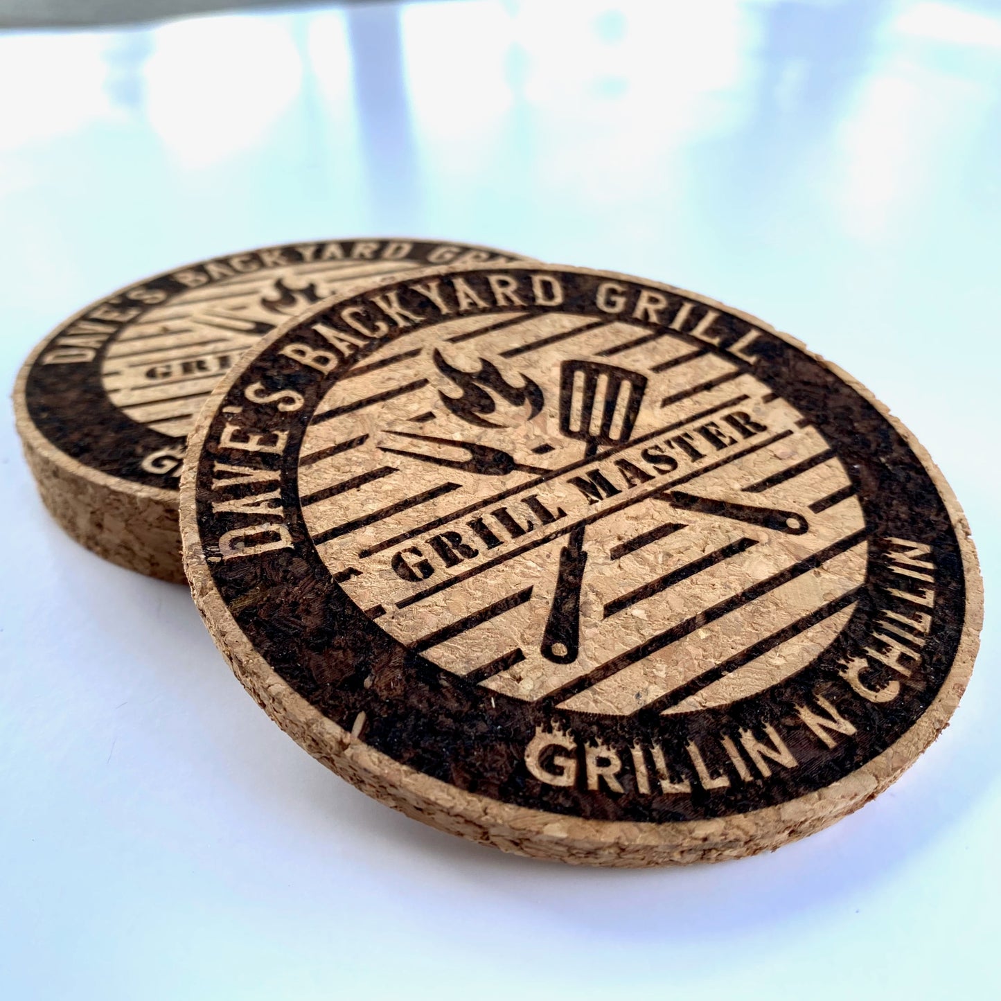 Elegant round cork coasters with your personalized first name on our Grill Master design. 